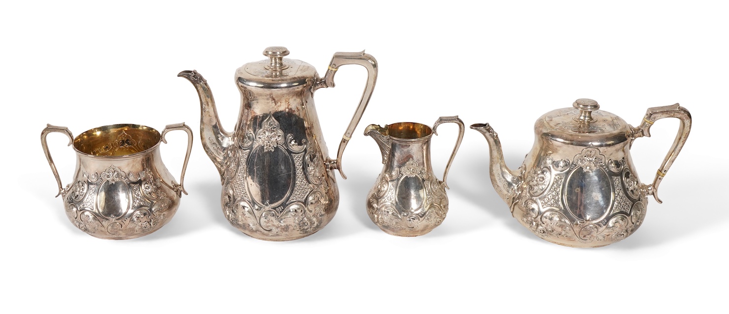 A Victorian embossed silver four piece tea and coffee service by Daniel & Charles Houle